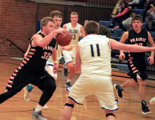 Spencer Schumacher heads upcourt after making a steal at Genesee. Also shown is Derik Shears.