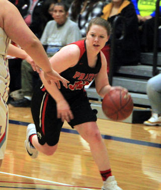 India Peery drives the ball toward the hoop against Lapwai at District.