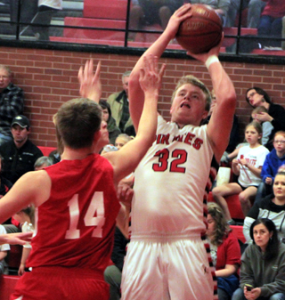 Spencer Schumacher shoots over a C.V. defender.