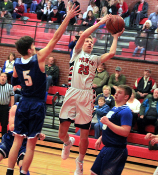 Damian Forsmann goes for a lay-in against Genesee in an elimination District game Monday at Cottonwood.