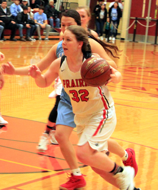 India Peery drives toward the hoop against Lapwai in the third place game at State. Also shown is Jordyn Higgins.