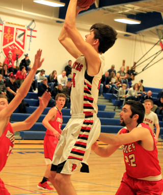 Devin Ross scores 2 of his game high 21 points against Oakley.