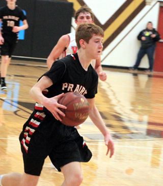 Cole Schlader drives to the hoop against Challis. He scored 10 of Prairie's 14 fourth quarter points to help the Pirates win.