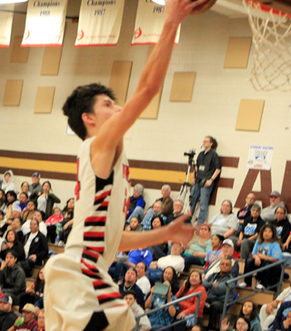Devin Ross scores a lay-up against Lapwai during Prairies 15-4 second quarter run.