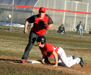 Owen Anderson gets up to head for second after a bad pickoff throw gets past the first baseman.