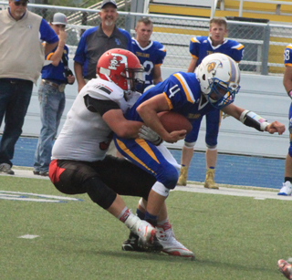 Dean Johnson sacks the Raft River quarterback.