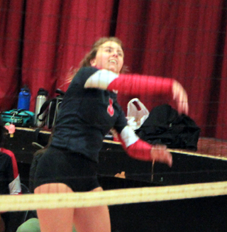 Brooklyn Riener spikes the ball against C.V.