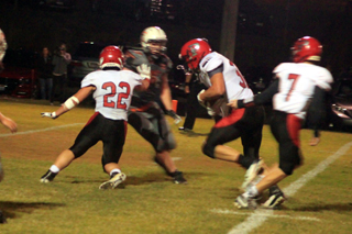When Owen Anderson, 22, wasnt scoring touchdowns, he was blocking for them as he blocks for Cole Martin on a plunge up the middle. Also shown is quarterback Cole Schlader, 7.