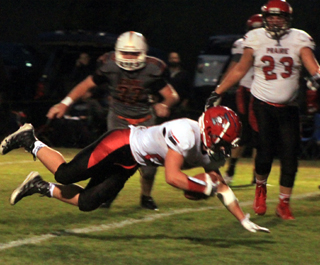 Owen Anderson dives across the goal line for one of his 5 touchdowns against Troy. Also shown is Hayden Uhlenkott.