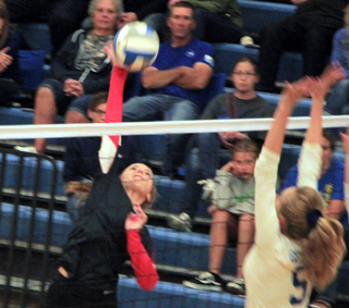 Delanie Lockett was called up to the varsity for the Genesee match and makes a spike.