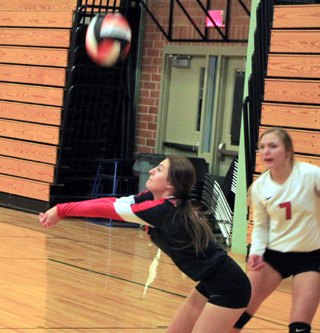 Anna Kaschmitter makes a pass as Sierra McWilliams watches at the Border Battle.