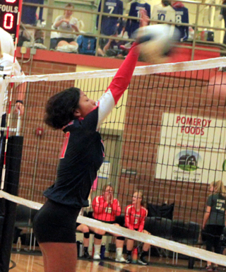 Trinity Martinez makes a block against Pomeroy at the Border Battle.