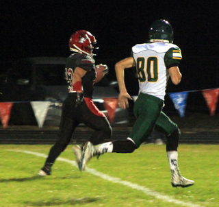 Owen Anderson heads for the end zone on Prairies first play from scrimmage against Potlatch.