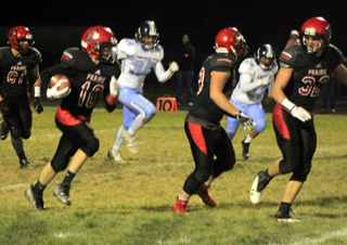 Sam Mager has Hayden Uhlenkott and Cole Martin leading the way on what turned out to be an 82 yard catch and run for a touchdown. At left is Reid Uptmor.