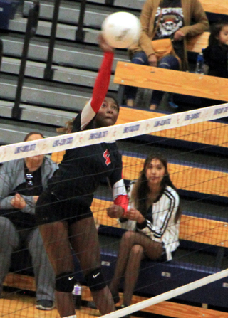 Madison Shears goes for a spike against Lapwai at District.