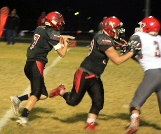Cole Schlader, left, gets a block from Hayden Uhlenkott that helped him on a 34 yard touchdown run against C.V.