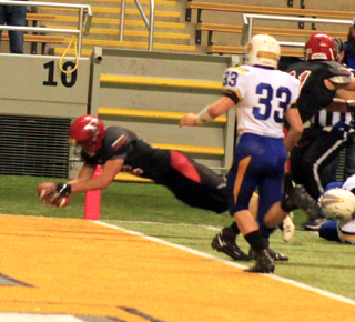 Cole Martin dives across the goal line for a Prairie touchdown.
