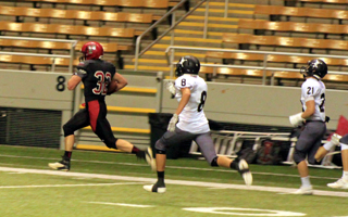 Cole Martin races down the sidelines ahead of 2 defenders on a 78 yard scoring run.
