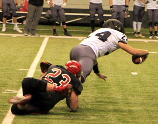 Hayden Uhlenkott with one of his 2 sacks of the Lost Rivers quarterback.
