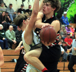 Derik Shears goes for a basket at St. Maries.