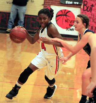 Madison Shears drives past a Grangeville defender during the Idaho County Shootout.