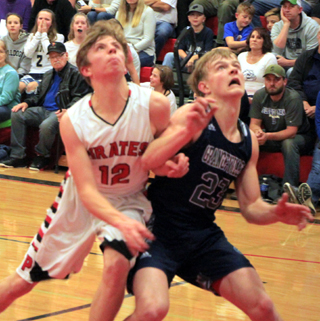 Sam Mager battles Grangevilles Kyle Frei for rebounding position at the Idaho County Shootout.