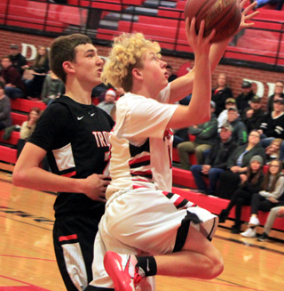 Kyle Schwartz goes for a lay-up against Troy.