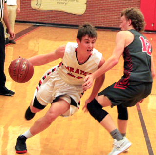 Owen Anderson drives past a C.V. defender.