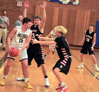 Derik Shears and Kyle Schwartz double-team a Genesee player. Also shown at right is Zach Rambo.