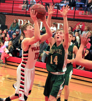Sam Mager got into the lane for this shot against St. Maries on Saturday.