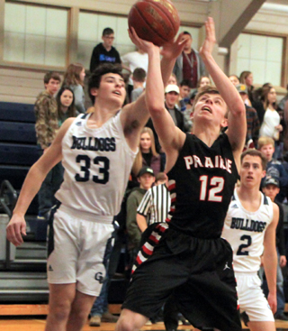 Sam Mager gets into the lane against Grangeville for a shot.