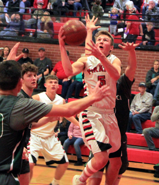 Damian Forsmann gets into the lane against Potlatch. Derik Shears can be seen in the background.