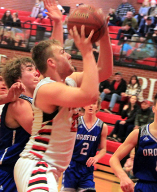 Hayden Uhlenkott drives to the hoop against Orofino.