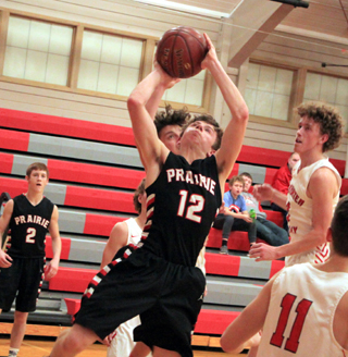 Sam Mager gets inside for a layup at C.V. Cole Schlader can be seen at left.
