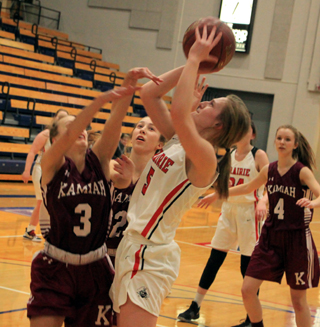 Ellea Uhlenkott puts up a shot against Kamiah at District. Ciara Chaffee can be seen in the background.