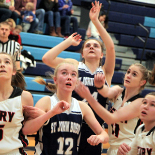 Jade Prigge has just put up a shot against Deary and everyone, including Dani Sonnen, 12, watches to see if it went in the basket.