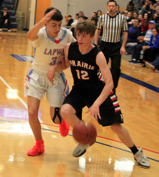 Sam Mager drives past Lapwais Kross Taylor.