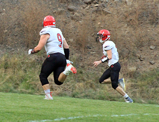 On the first play of the game Cole Schlader races down the sideline for a 40 yard scoring run with the only player close to him being offensive lineman Dean Johnson.