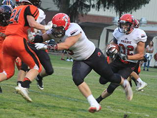Dean Johnson makes a block that springs Cole Martin for a 69 yard touchdown run.