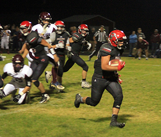 Brody Hasselstrom breaks loose for one of his 6 touchdowns against Kamiah.
