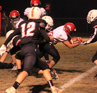 Brody Hasselstrom pushed through the defense to the goal line for Prairie’s only touchdown of the second half at Troy. They scored more than enough in the first half to win the game.