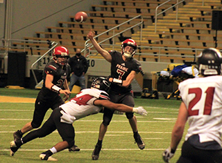 Cole Schlader got this pass away just prior to getting hit. Also shown is Chase Kaschmitter.