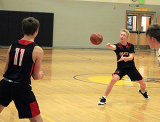 Kyle Schwartz passes to Lane Schumacher at Timberline.