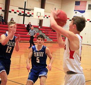 Lane Schumacher is about to shoot the game-winning 3-pointer against Genesee. And yes this is at the Elementary School gym due to a power outage at the high school