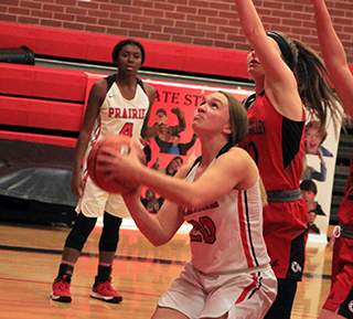 Molly Johnson got inside the defense for a lay-up against C.V. as Madison Shears watches.