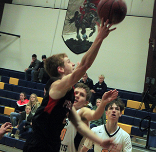 Cole Schlader scores 2 of his 29 points at Logos.