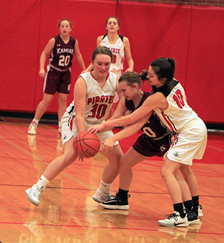 Molly Johnson and Ali Rehder doubleteam a Kamiah player in Monday's JV game against the Kubs.