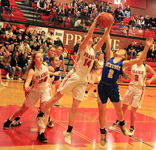 Tara Schlader grabs a rebound against Genesee. Also shown are Laney Forsmann, Hope Schwartz and Delanie Lockett.