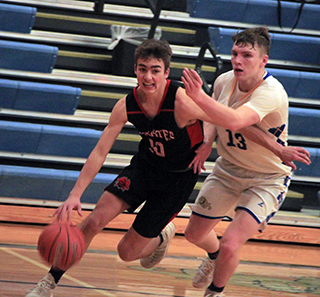 Zach Rambo drives past a Genesee defender.