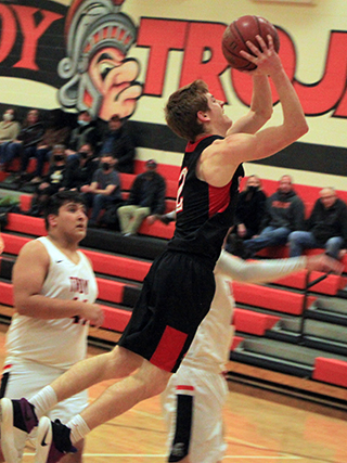 Cole Schlader jumps toward the basket on this shot at Troy.